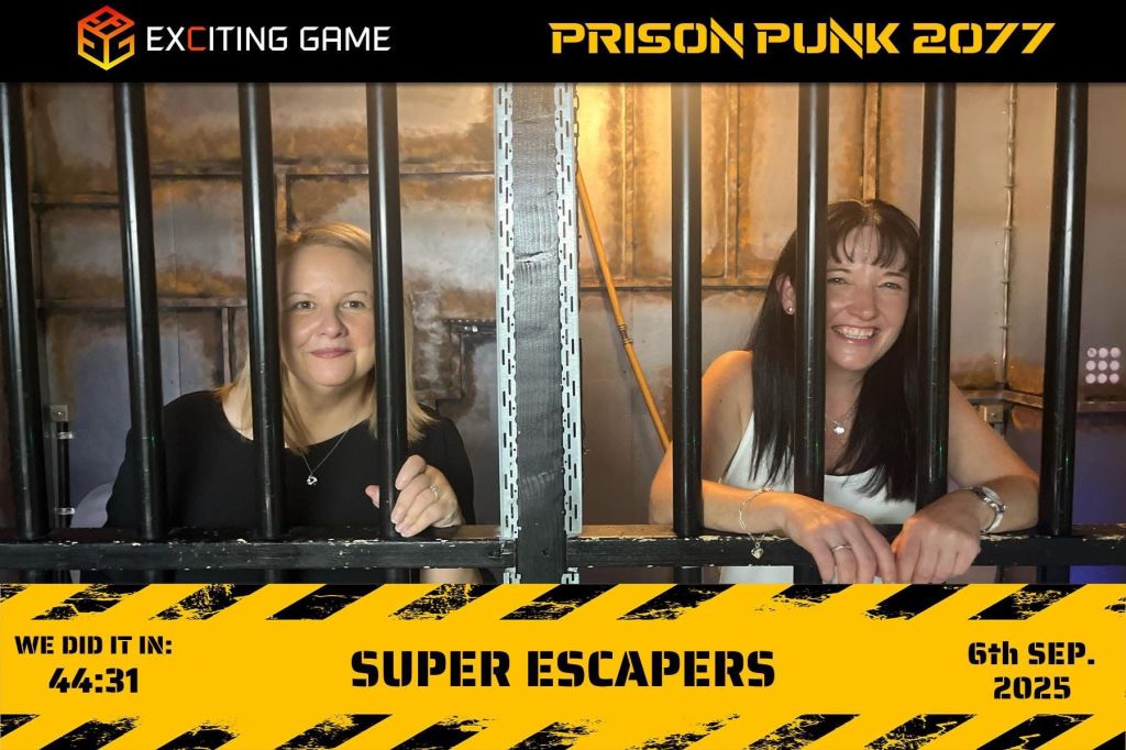 A photo of Sarah with her friend Sam behind bars at an escape room
